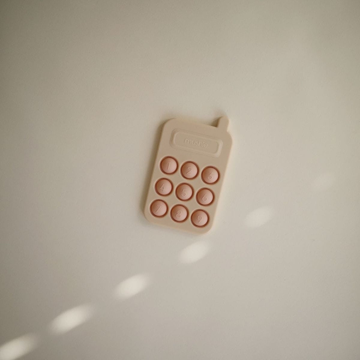 Pop it - Téléphone rose Mushie